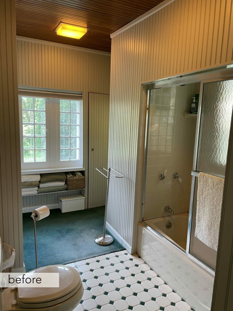 before image of vintage bathroom with green carpeting and paneled walls