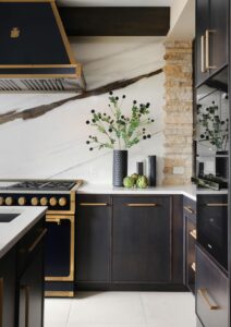 black kitchen with porcelain slab backsplash