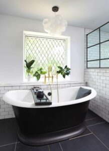 Freestanding bathtub with underside painted black
