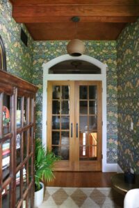 French doors in a small office with wood ceiling