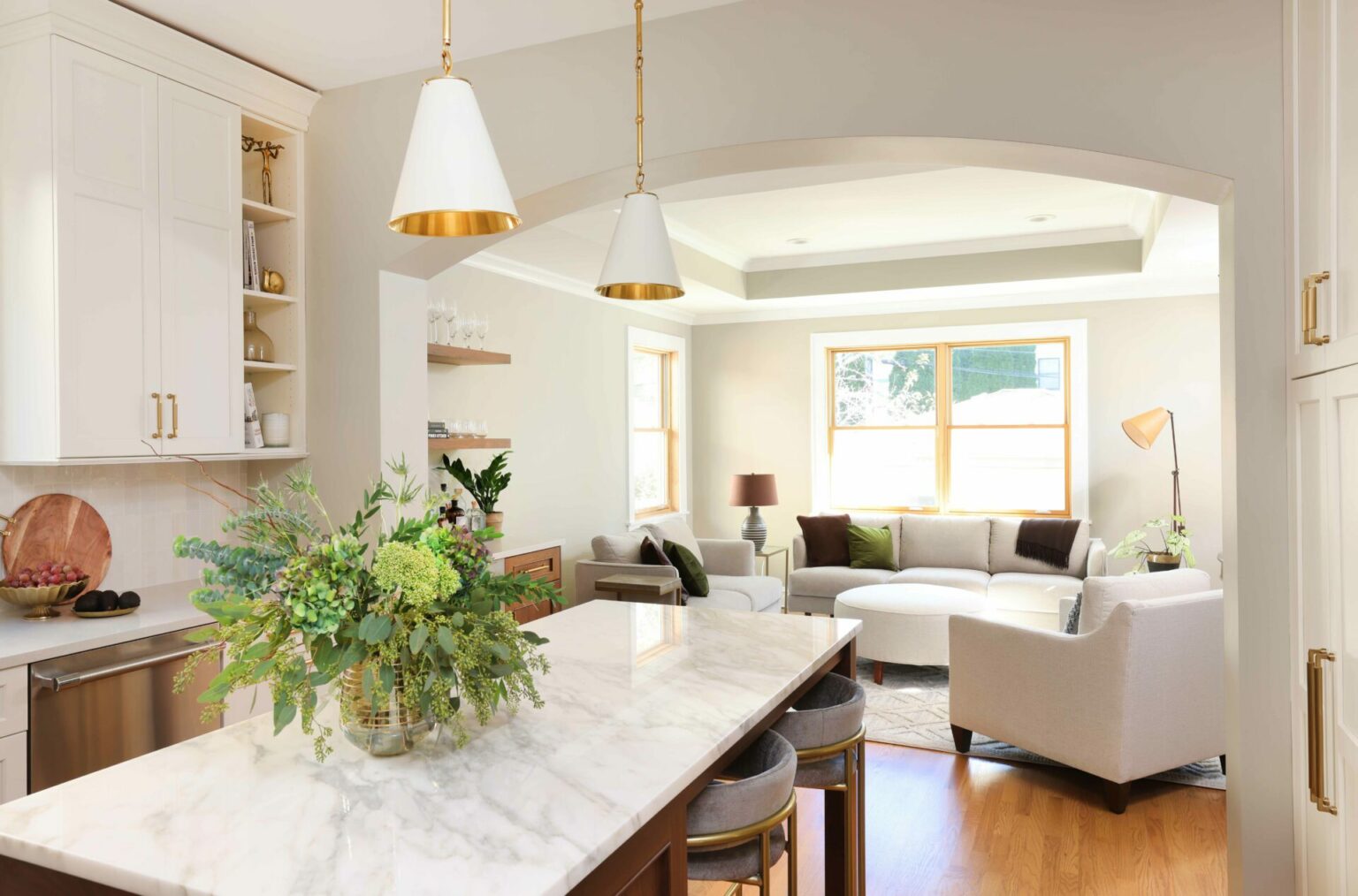 Open-concept living space featuring custom cabinetry and natural light