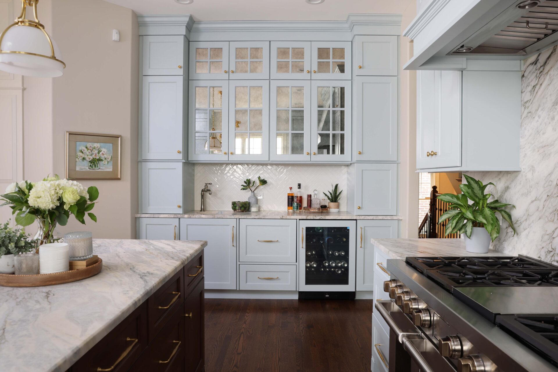 Light blue home bar with antique mirror glass doors to coordinate with light blue kitchen