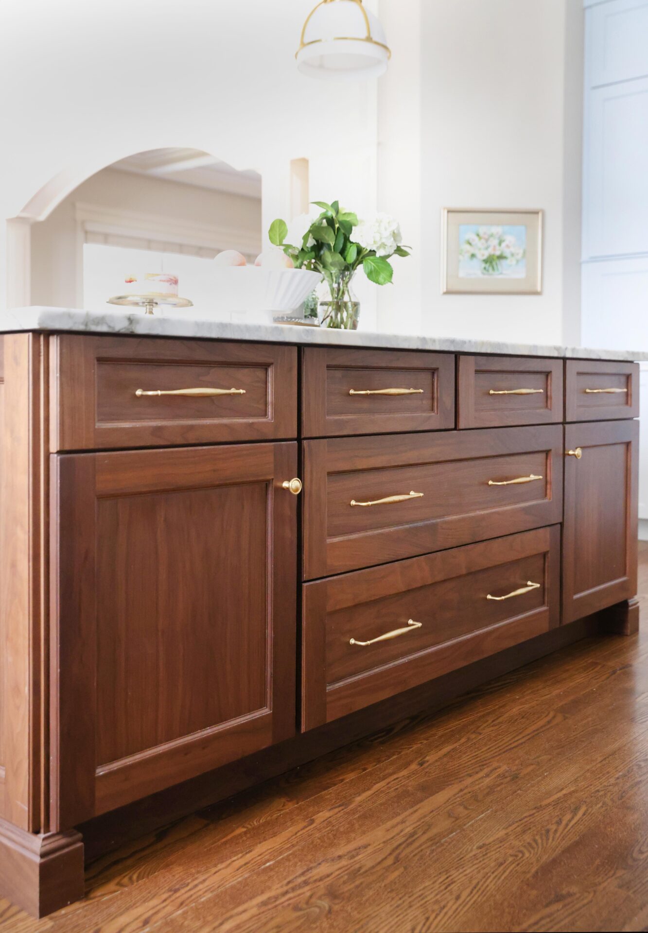 Stained walnut kitchen island in a traditional style kitchen design