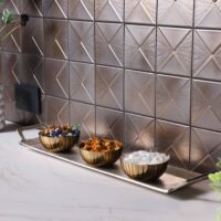 Metallic geometric tile backsplash with quartz countertop