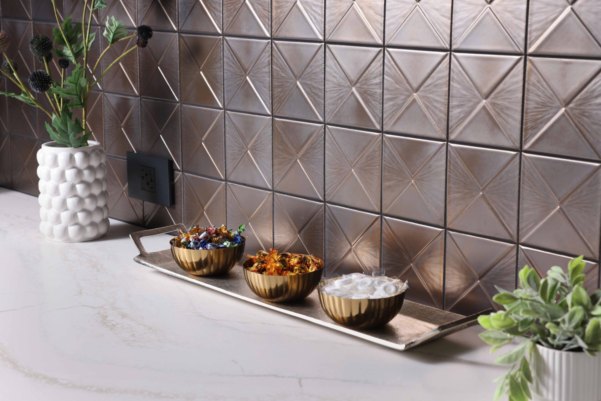 Metallic geometric tile backsplash with quartz countertop