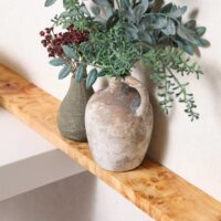 Stained olive wood ledge in Mediterranean style powder room