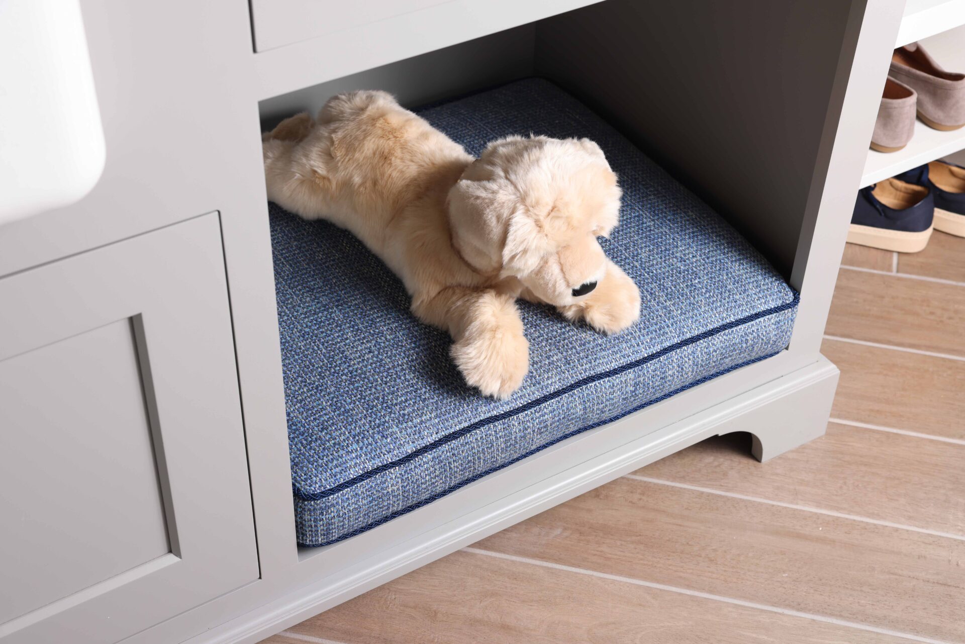 Cabinet molding at bottom, dog nook cat nook, light gray cabinetry