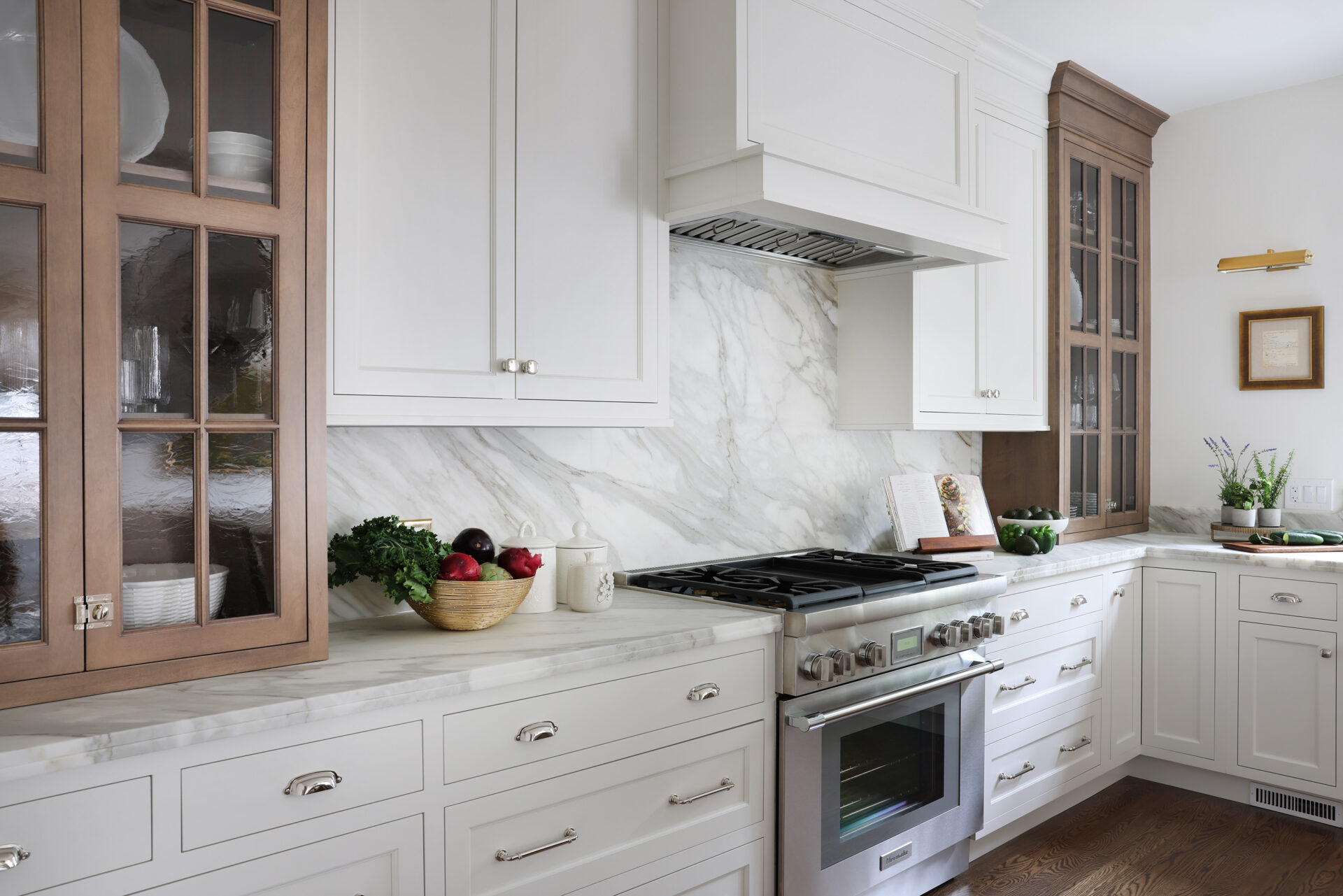 Classic Elmhurst Kitchen features a full height slab backsplash behind a 36-inch range.