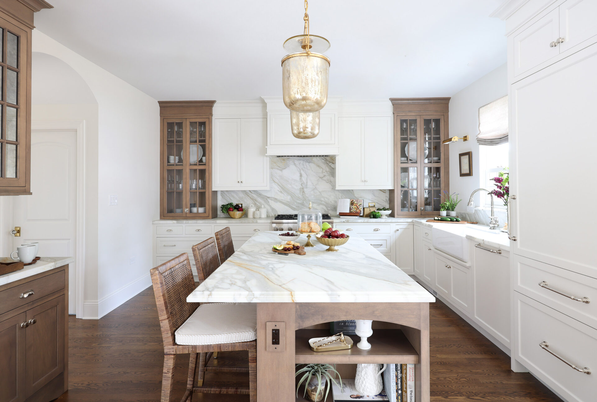 Classic Elmhurst Kitchen creates symmetry using a balance of dark and light cabinetry.