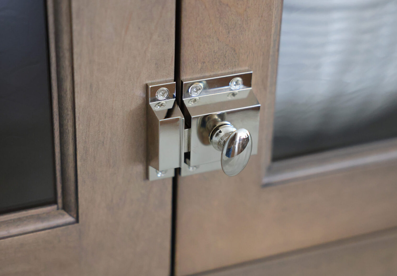 Classic Elmhurst Kitchen features cabinet latches on selected doors.