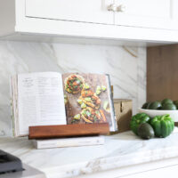Classic Elmhurst Kitchen features marble countertops with stepped and beveled edges.