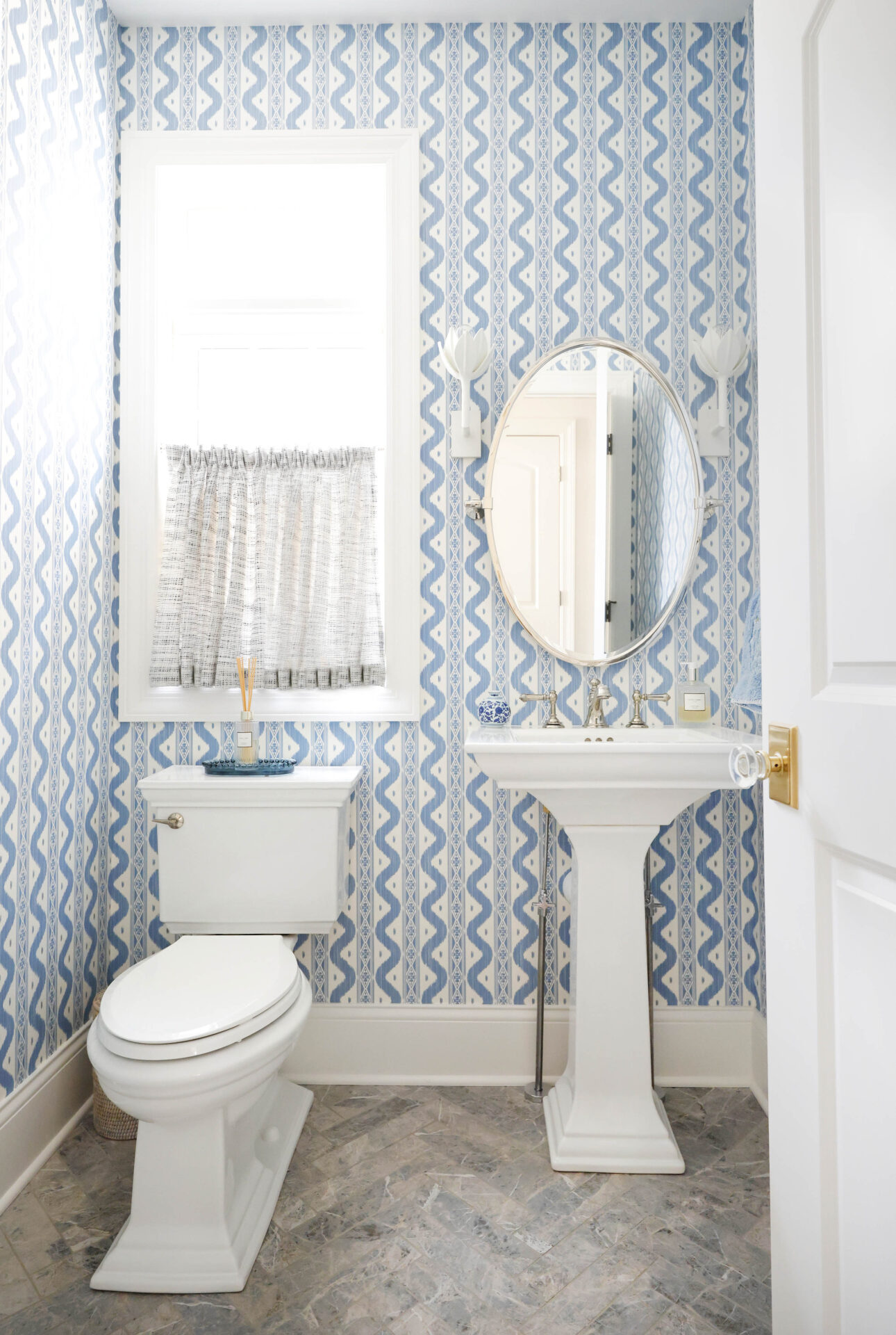 Classic Elmhurst Kitchen and First Floor Renovation includes a delightful powder room with pedestal sink and matching toilet.