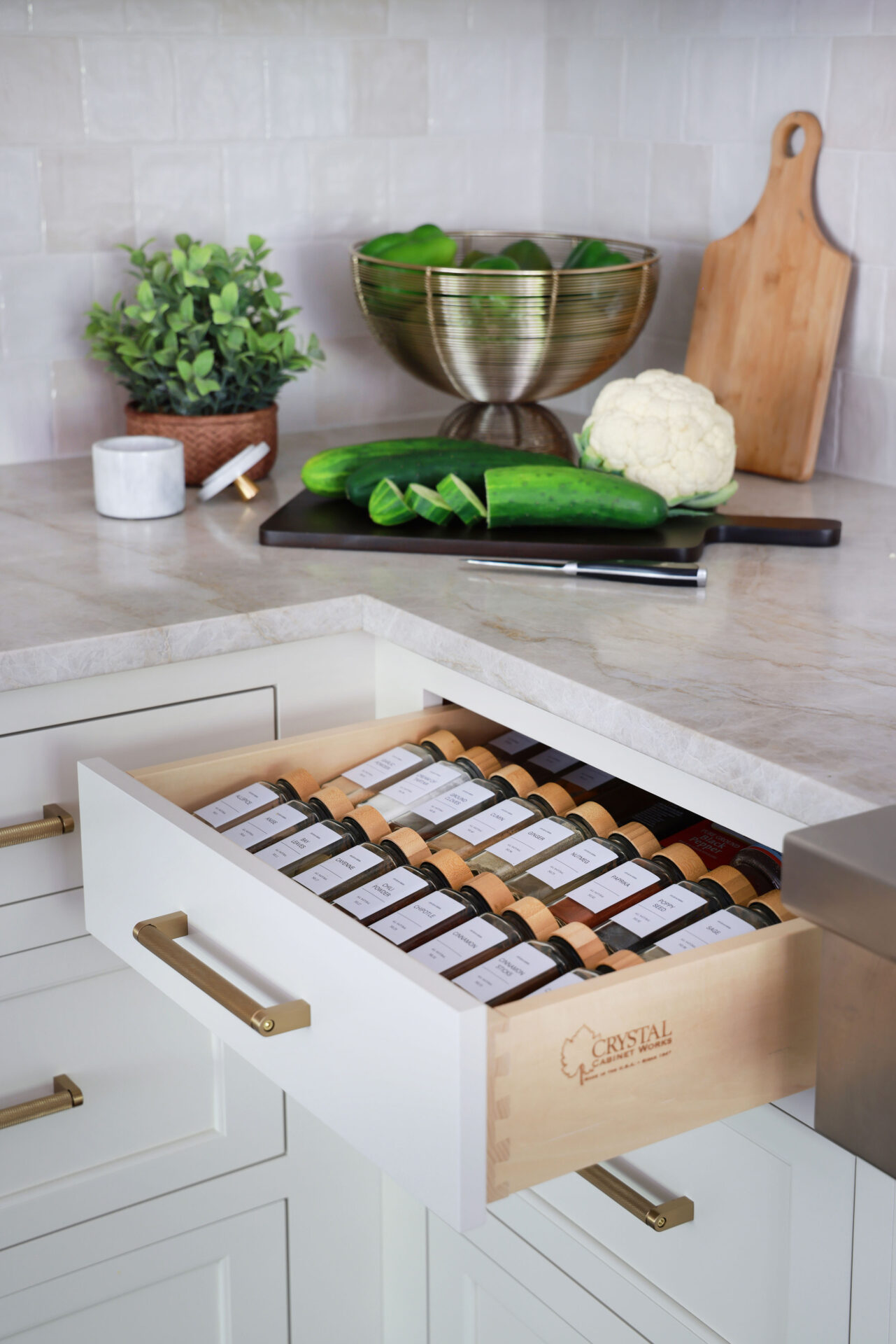 Updated traditional kitchen: A spice drawer organizer next to the range makes cooking a breeze.