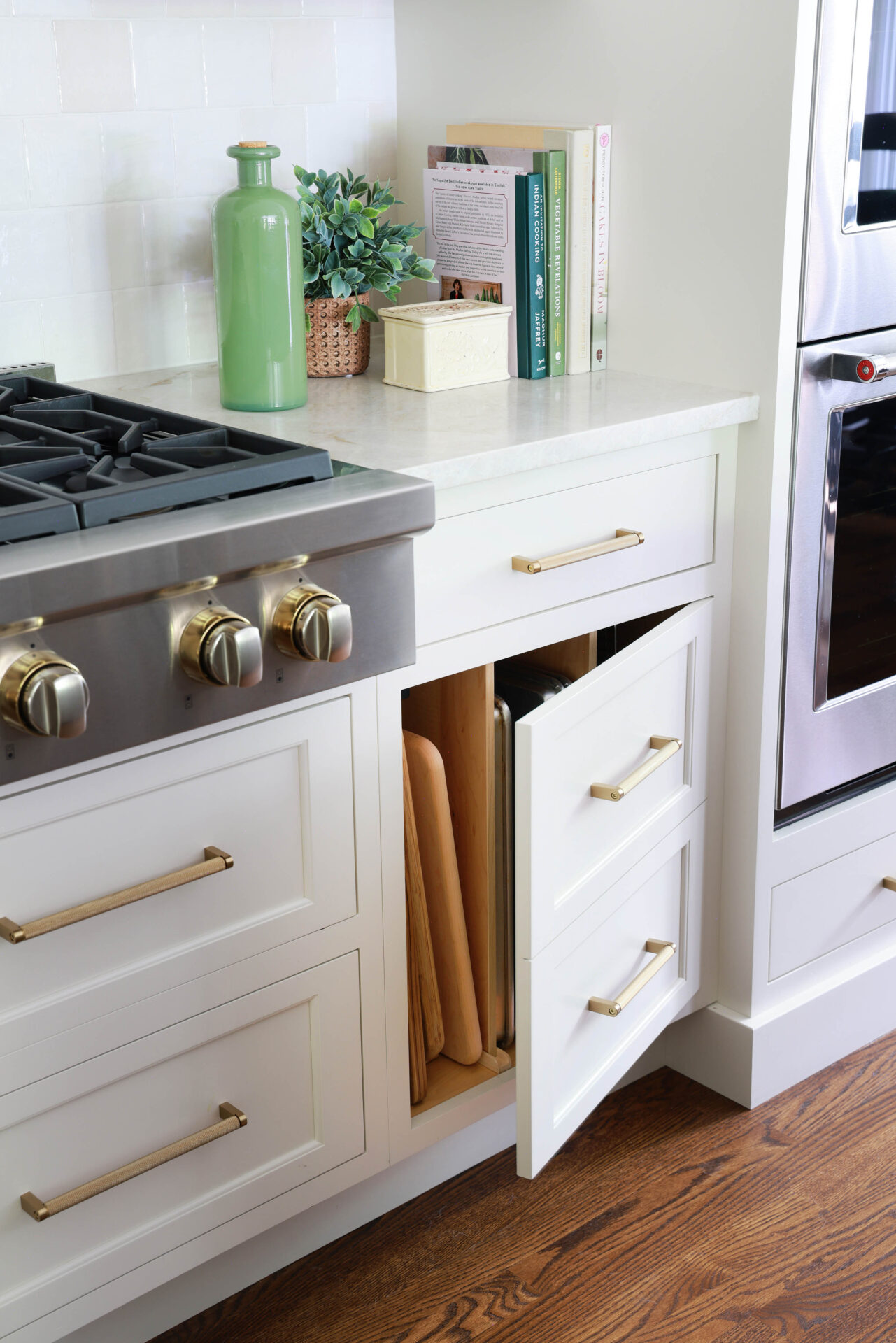 Updated traditional kitchen: Using drawer fronts on some cabinet doors helps maintain consistency and visual harmony across the all of the perimeter cabinets.