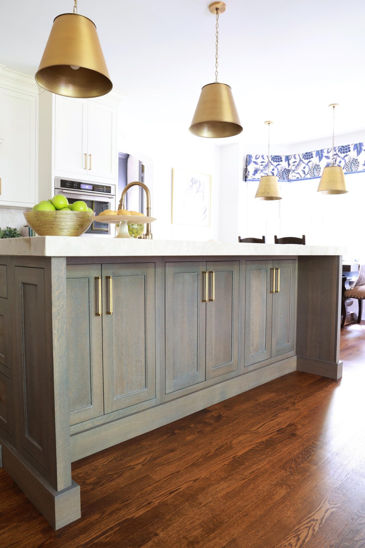 Updated traditional kitchen: Abundant storage is built into the quarter-sawn oak island.