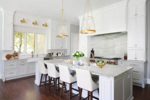 Gold lighting fixtures, farmhouse sink