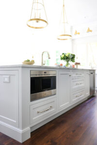 Light gray island with below counter microwave