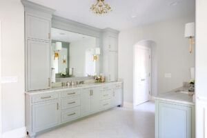 Gold hardware and sconces, arched doorway