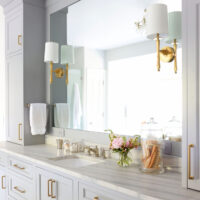 gold sconces, rectangular sink, leathered countertop