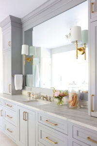 gold sconces, rectangular sink, leathered countertop