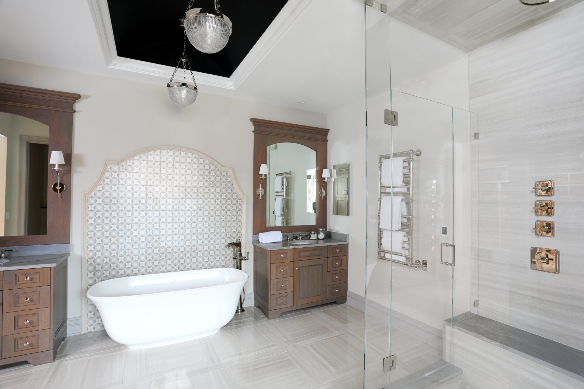 A barrel ceiling adds depth, scale and helps unify all of the elements in this primary bath.