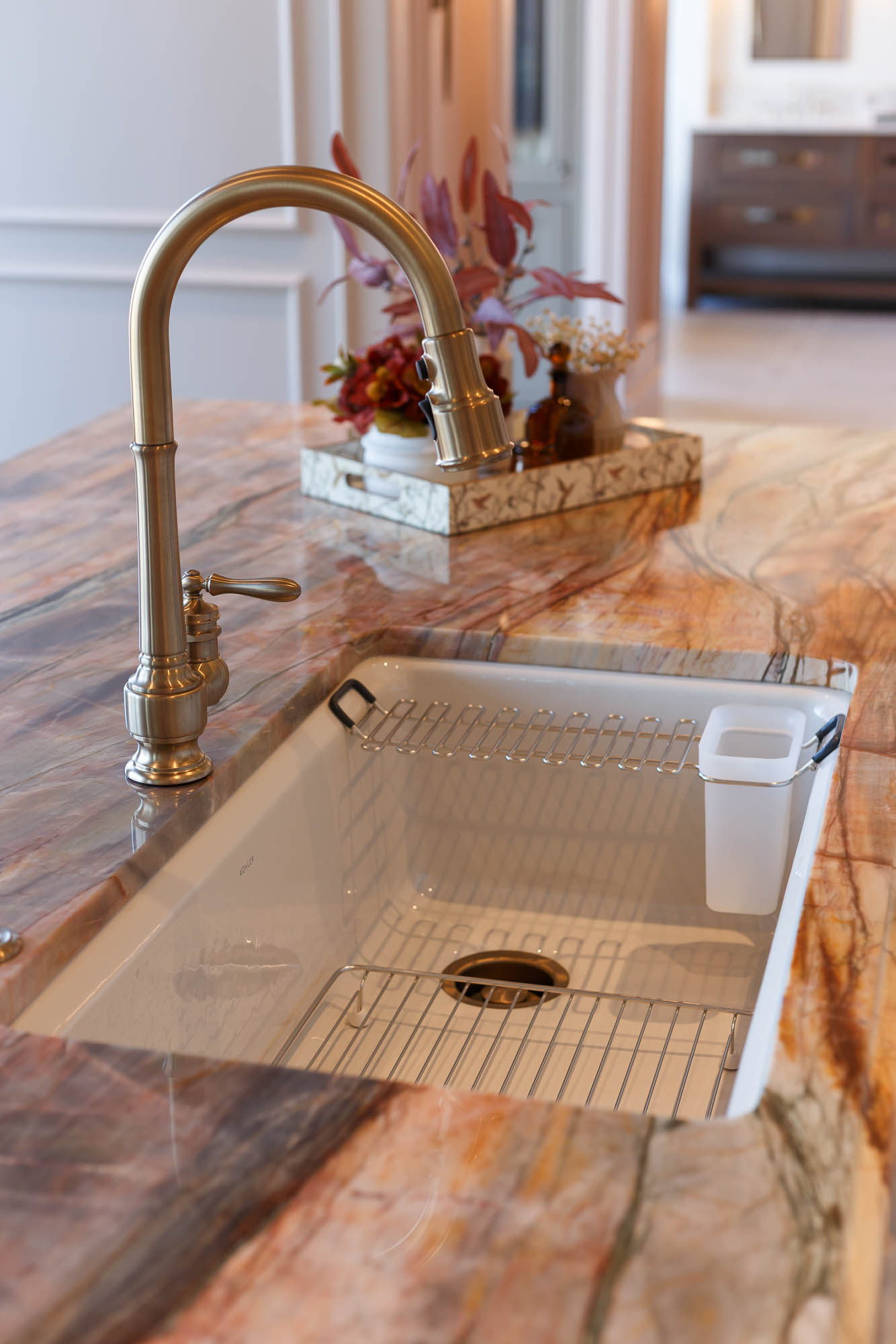 Workstation sink with ledge for accessories, including this utility rack with container.